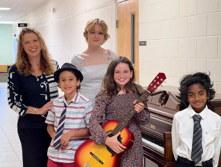 Performers from age 7-12 on piano, guitar, and singing.